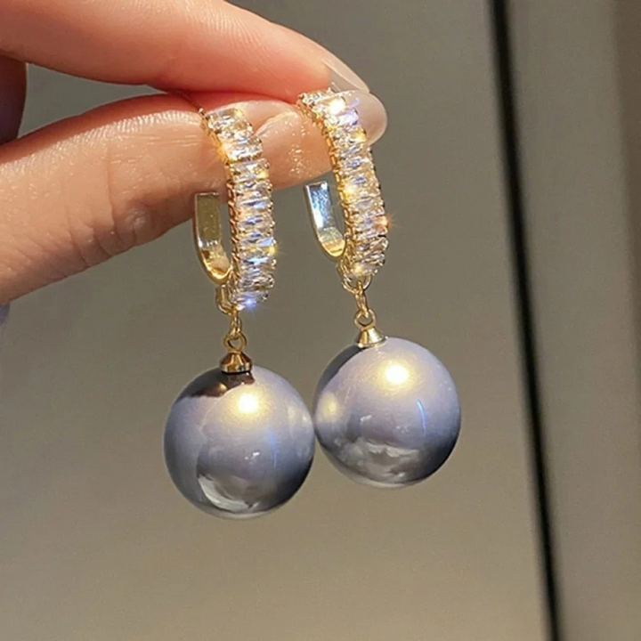 Elegante Ohrringe mit Perlen und Zirkonia